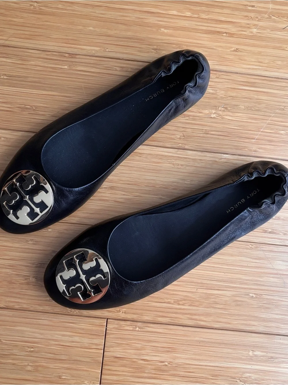 Tory Burch reva black leather ballet flats with gold tone detail